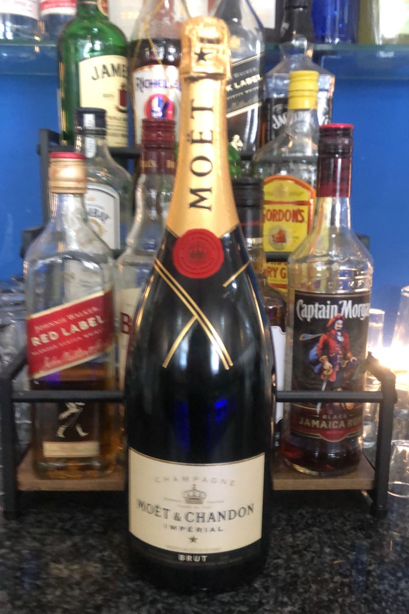 Champagne and spirits lined up on the bar