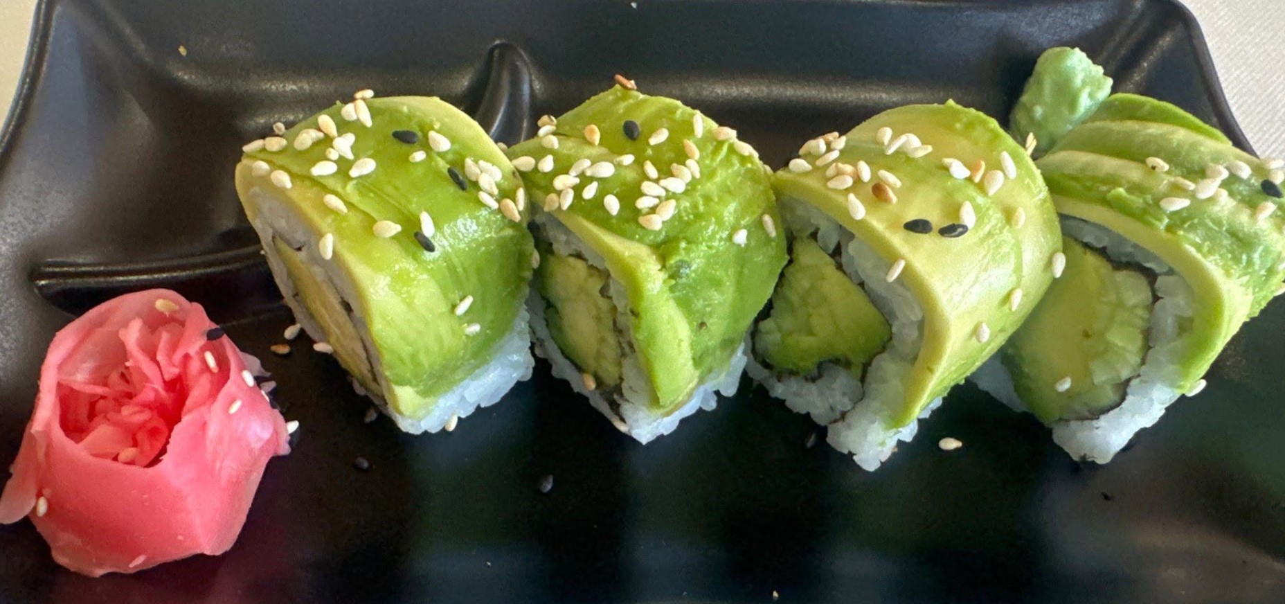 Avocado-topped rolls with sesame and pickled ginger