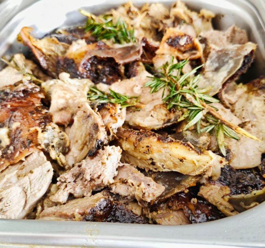 Carved lamb on the spit with rosemary