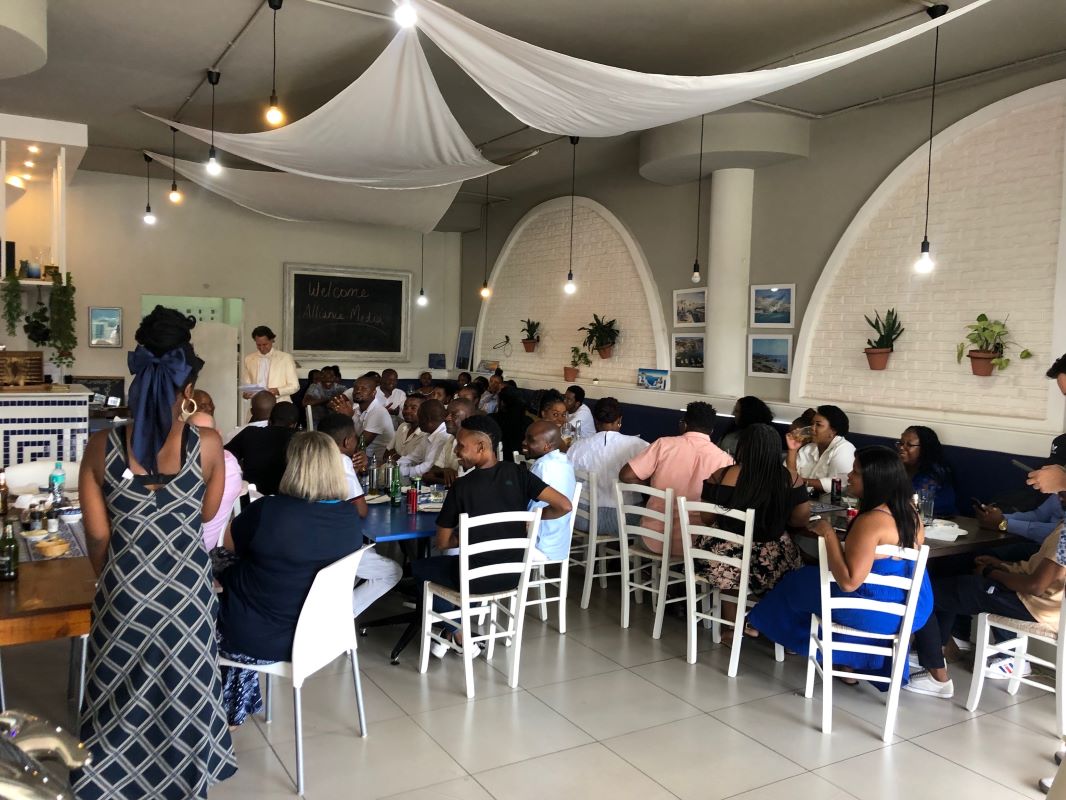Company function with guests seated at long tables