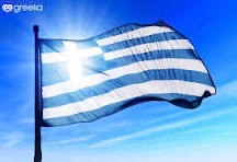 Greek flag flying against a blue sky
