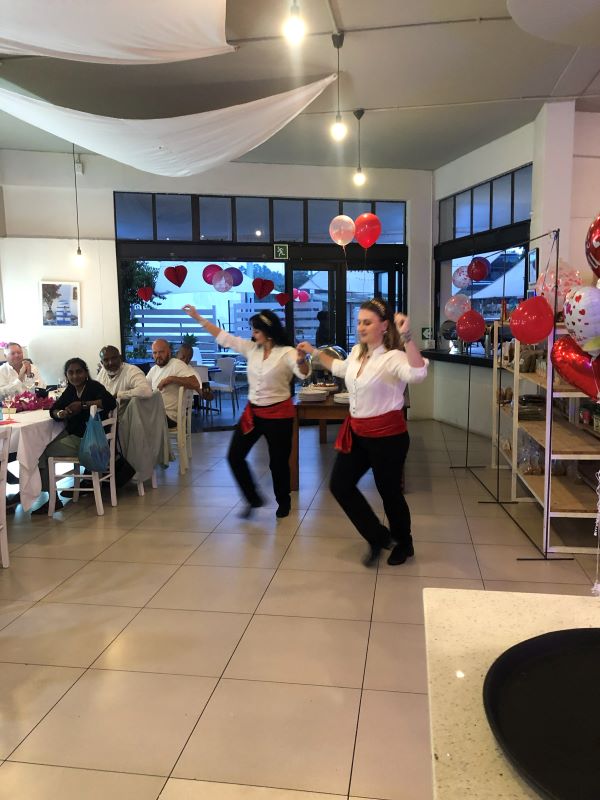 Greek dancers performing at a party