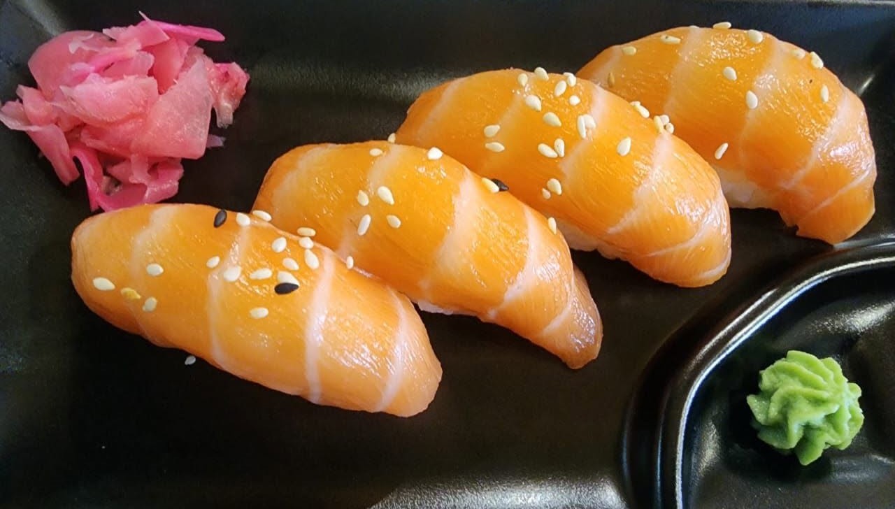 Salmon nigiri with wasabi and pickled ginger