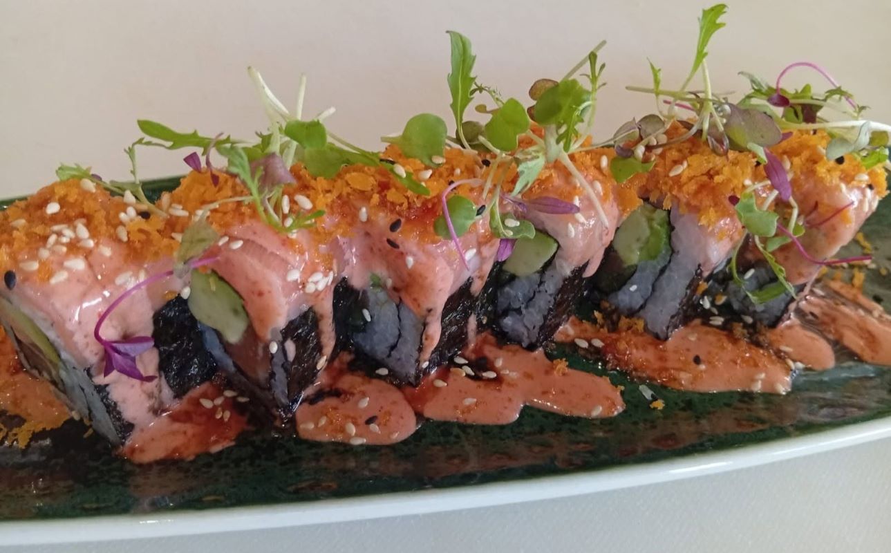 Signature salmon roll with spicy mayo, crisp topping and micro herbs