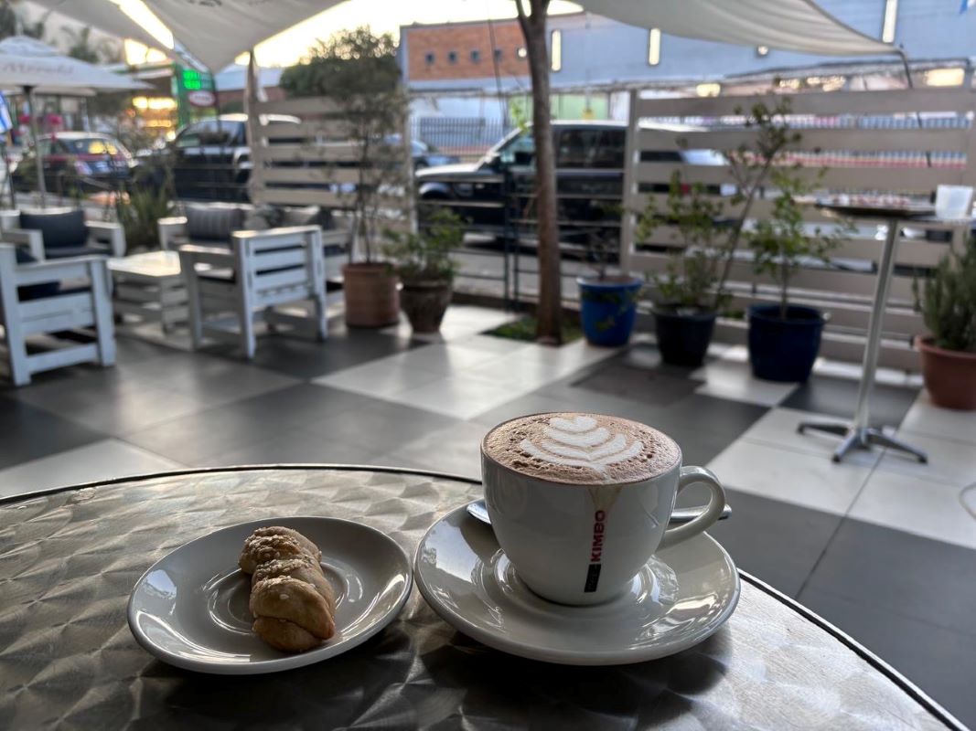 Cappuccino and koulourakia on the pavement terrace
