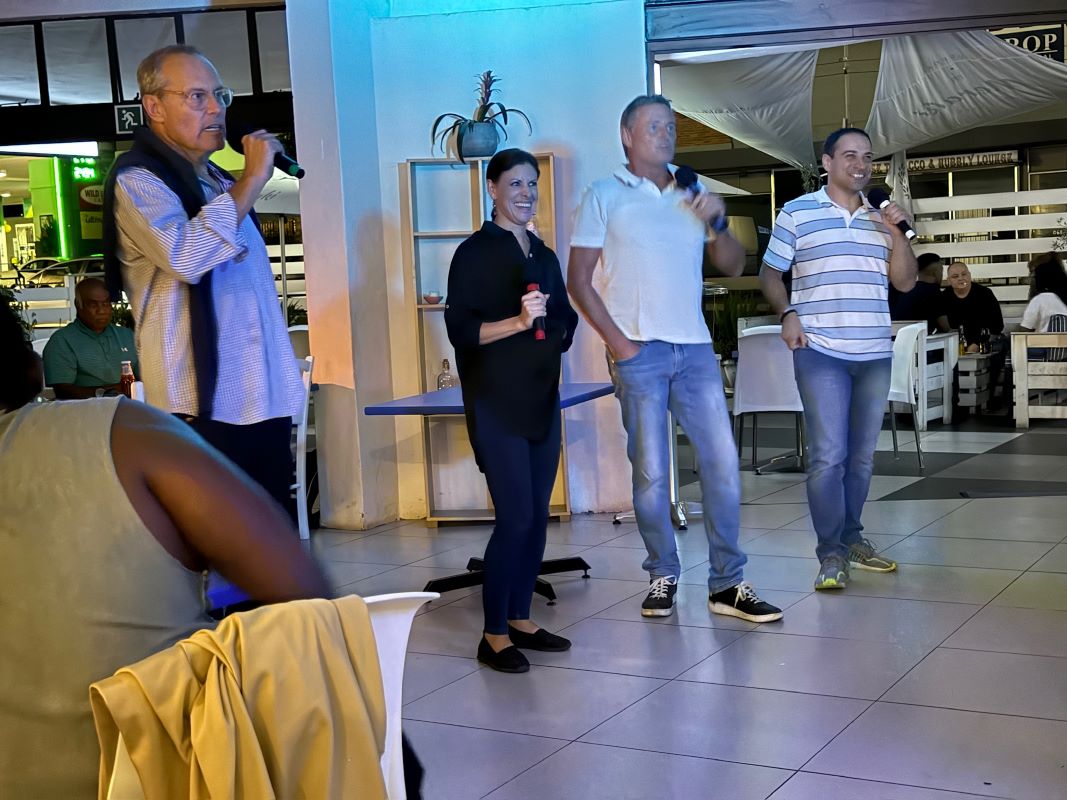Guests singing with microphones at an evening event